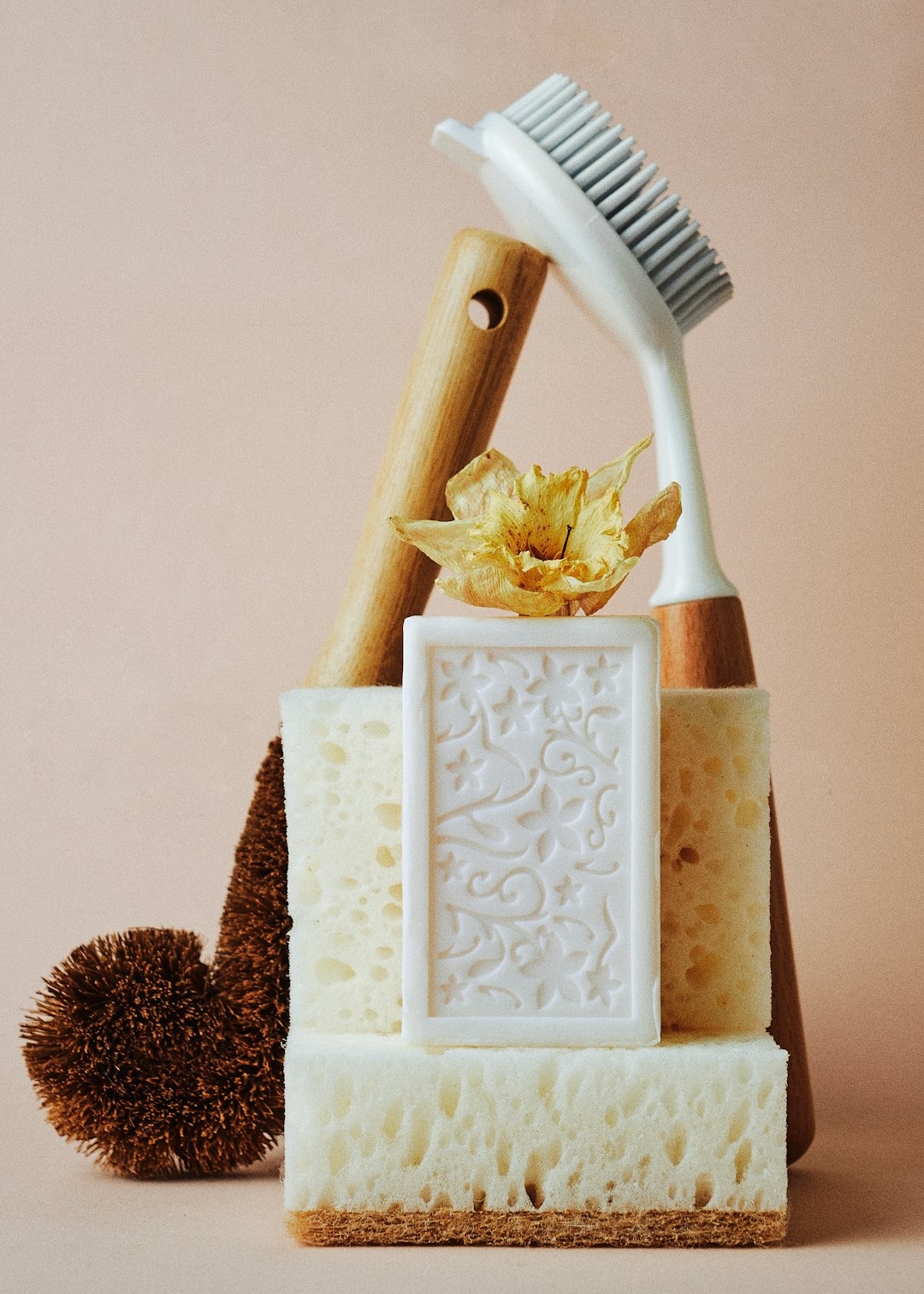 Eco-friendly cleaning supplies and soap arranged on a table.